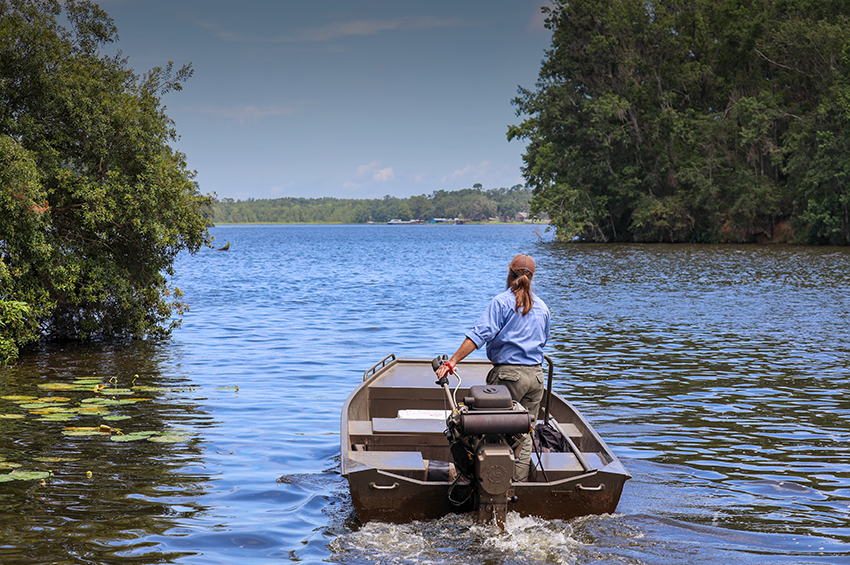 Water Scientist on the water in a boat